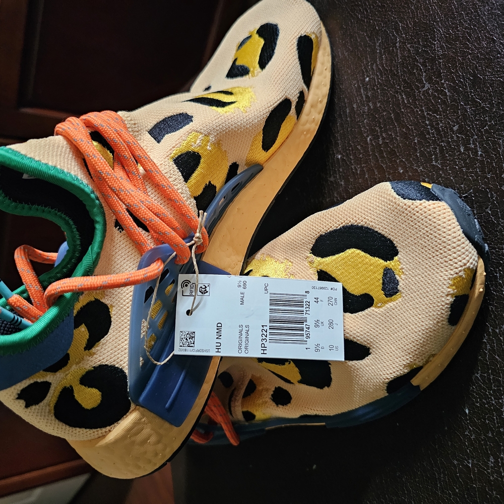 Adidas Cream and Orange Slip-On Sneakers with Bold Design